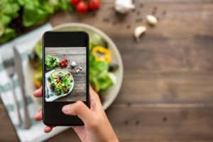 smart phone taking photo of food