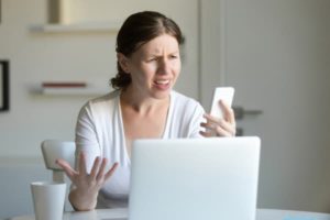 woman confused at phone
